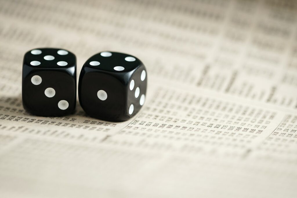 A pair of dice on stock listings