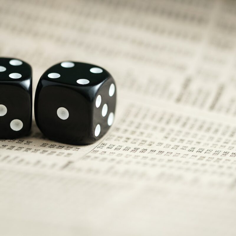 A pair of dice on stock listings