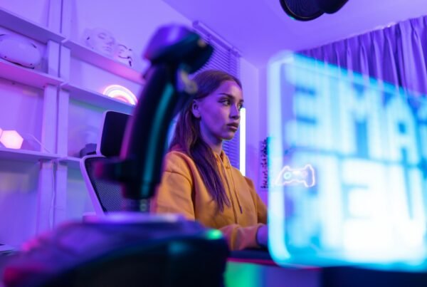 Online Streamer builds profitable audience via subscriptions and ads in vibrant, modern home office